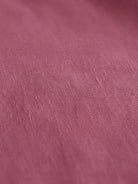 Cotton-linen blazer with notch lapels, two-button front, patch pockets, and relaxed fit.