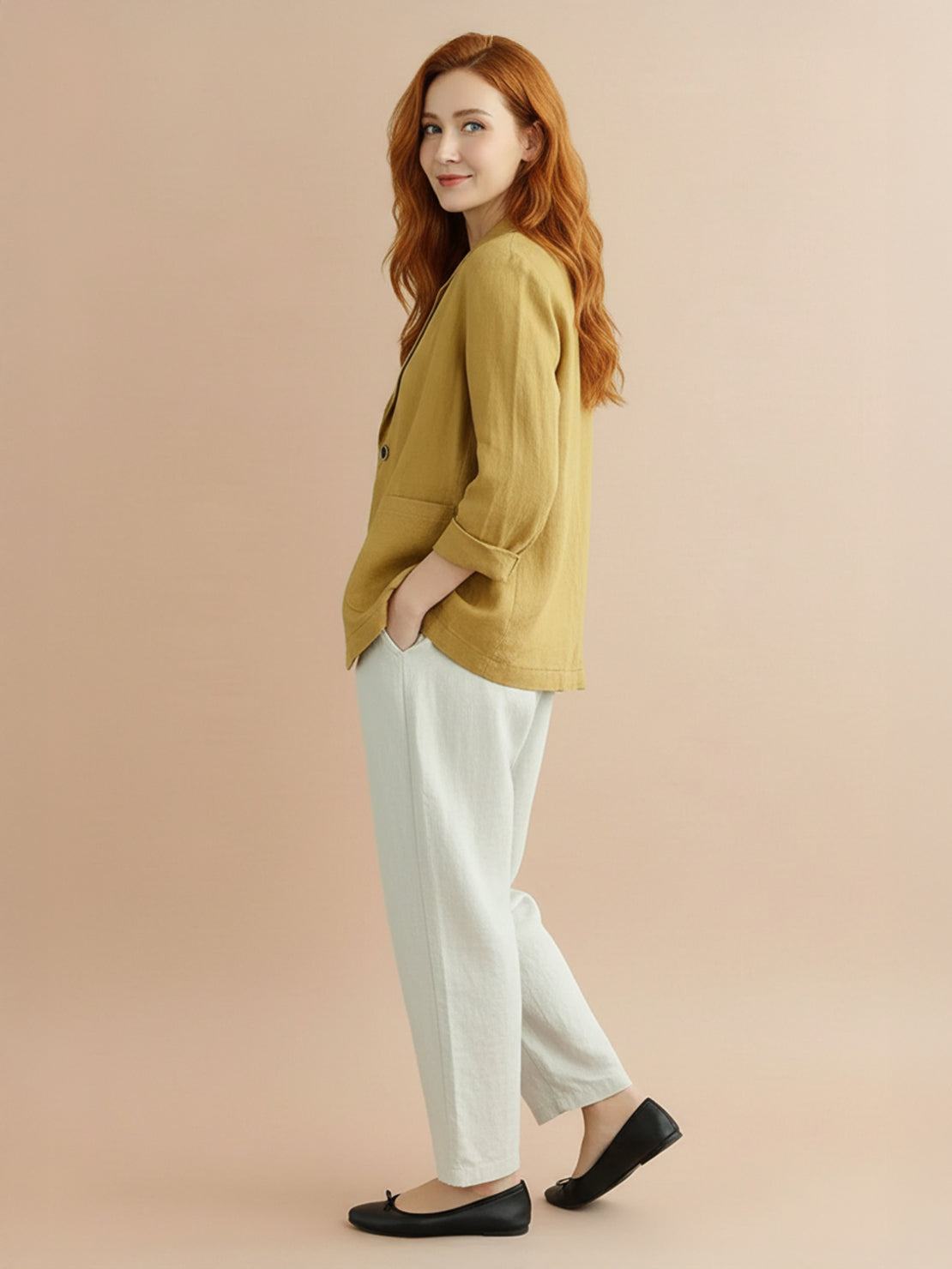 Cotton-linen blazer with notch lapels, two-button closure, and relaxed fit on natural textured fabric.