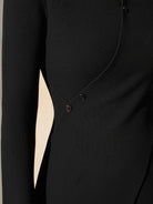 Asymmetric wrap ribbed knit top with diagonal button closure and flared cuffs in slim fit