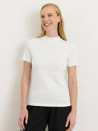 Slim-fit 100% Merino wool short-sleeve mock neck tee in neutral color, breathable and wrinkle-resistant