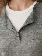 organic linen henley top fine knit soft breathable long sleeve shirt with 3-button placket and side slits in neutral heathered color