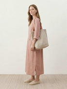 White 100% linen A-line maxi dress with 3/4 sleeves and large hip pockets