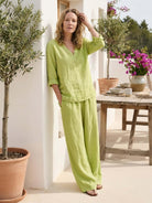 Lightweight 100% cotton linen set with V-neck top and wide-leg pants, breathable and relaxed fit.