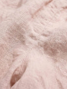 100% linen balloon-leg harem pants with elastic drawstring waistband and side pockets in natural crinkle texture