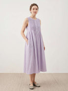 Sleeveless cotton linen pleated midi dress with pintuck bodice and A-line calf-length skirt