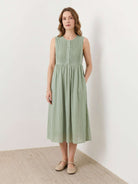 Sleeveless cotton linen pleated midi dress with pintuck bodice and full A-line skirt