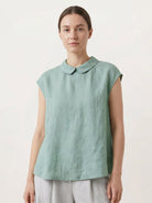 100% linen two-way button blouse with Peter Pan collar and cap sleeves in relaxed A-line silhouette