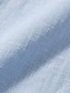 Loose oversized 100% linen dropped-shoulder shirt with side slits and rollable cuffs