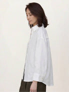 Loose-fit 100% linen dropped-shoulder shirt with long rollable sleeves and side slits