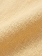 100% linen oversized dropped-shoulder shirt with long rollable sleeves and side slits