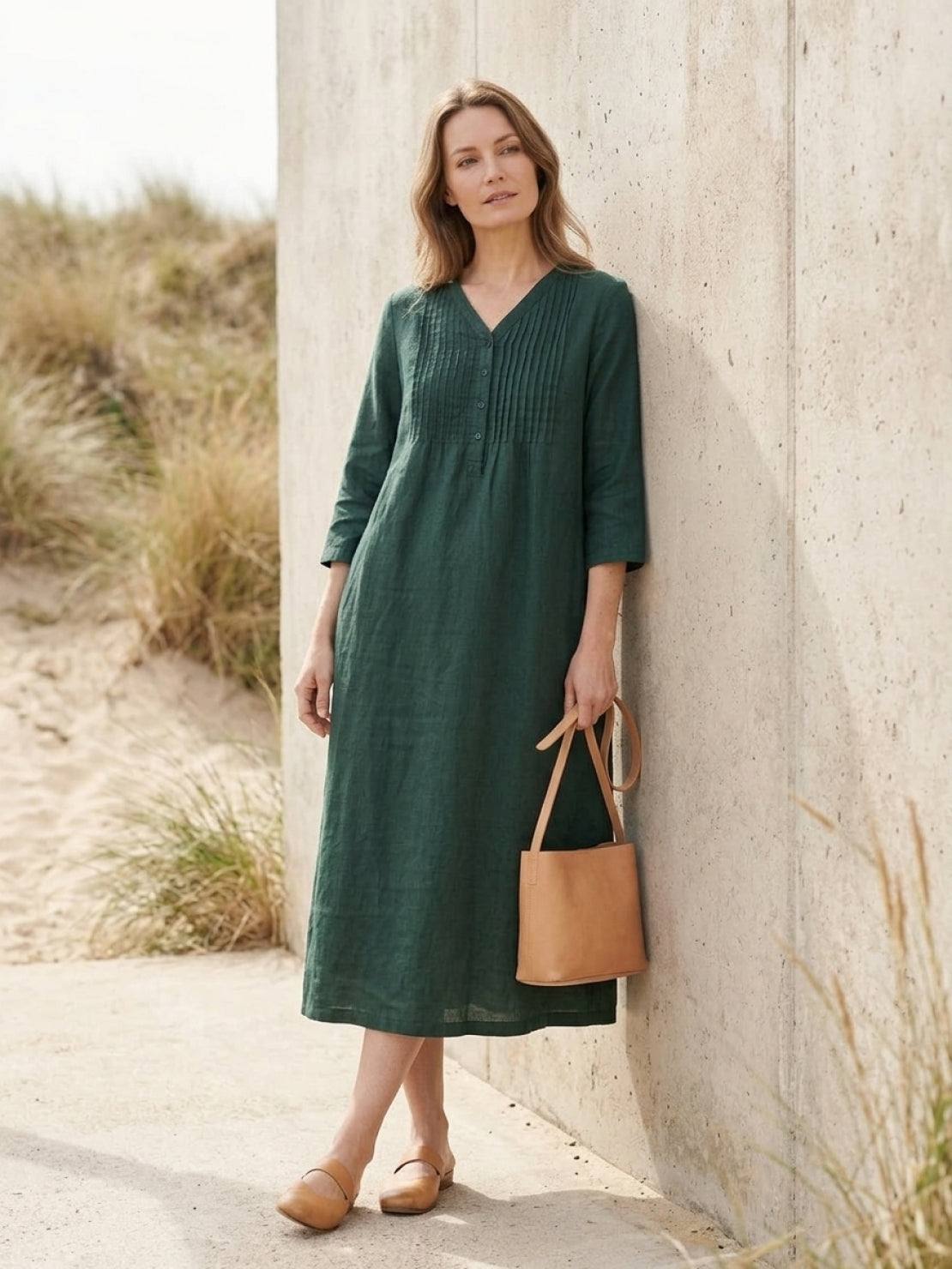 Relaxed A-line cotton linen dress with pintuck pleats, 3/4 sleeves, side slits, and breathable fabric.