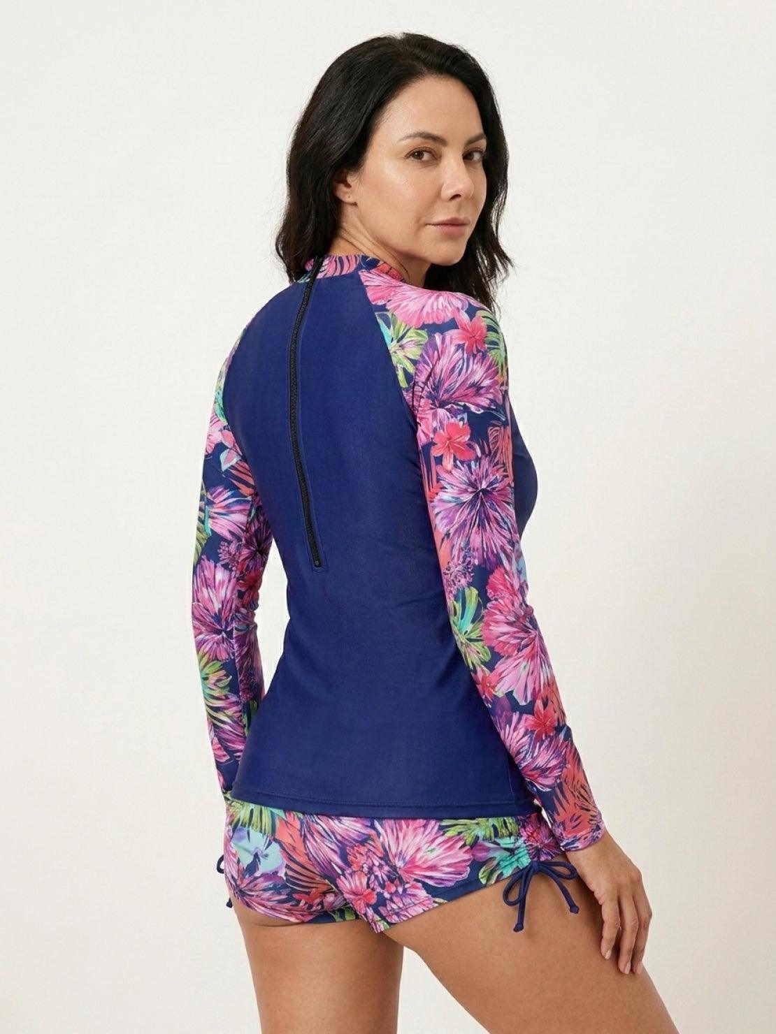 Tropical print rash guard set with long sleeves and matching boy-cut swim shorts.