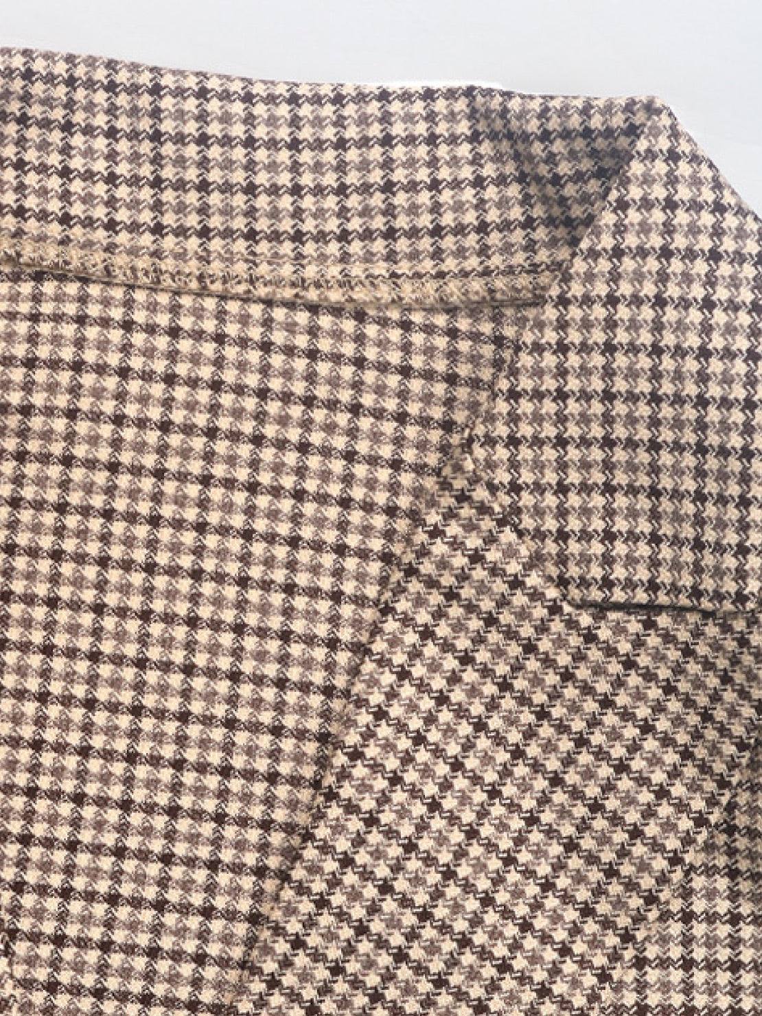 Classic houndstooth commuter blazer with structured shoulders, relaxed fit, notched lapel, and double-button closure.