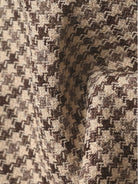 Structured black and white houndstooth commuter blazer with relaxed fit and notched lapel collar