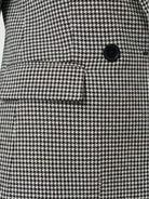 Black and white classic houndstooth commuter blazer with structured shoulders and double-button closure