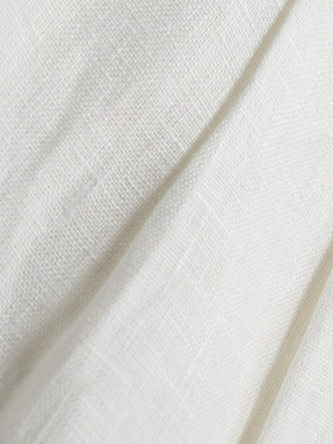 White linen belted shorts with high-rise waist and wide-leg relaxed fit