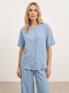 100% cotton two-piece set with button-front top and wide-leg pants in soft solid colors