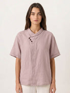 100% linen relaxed V-neck top with asymmetric button detail and short sleeves in breathable fabric