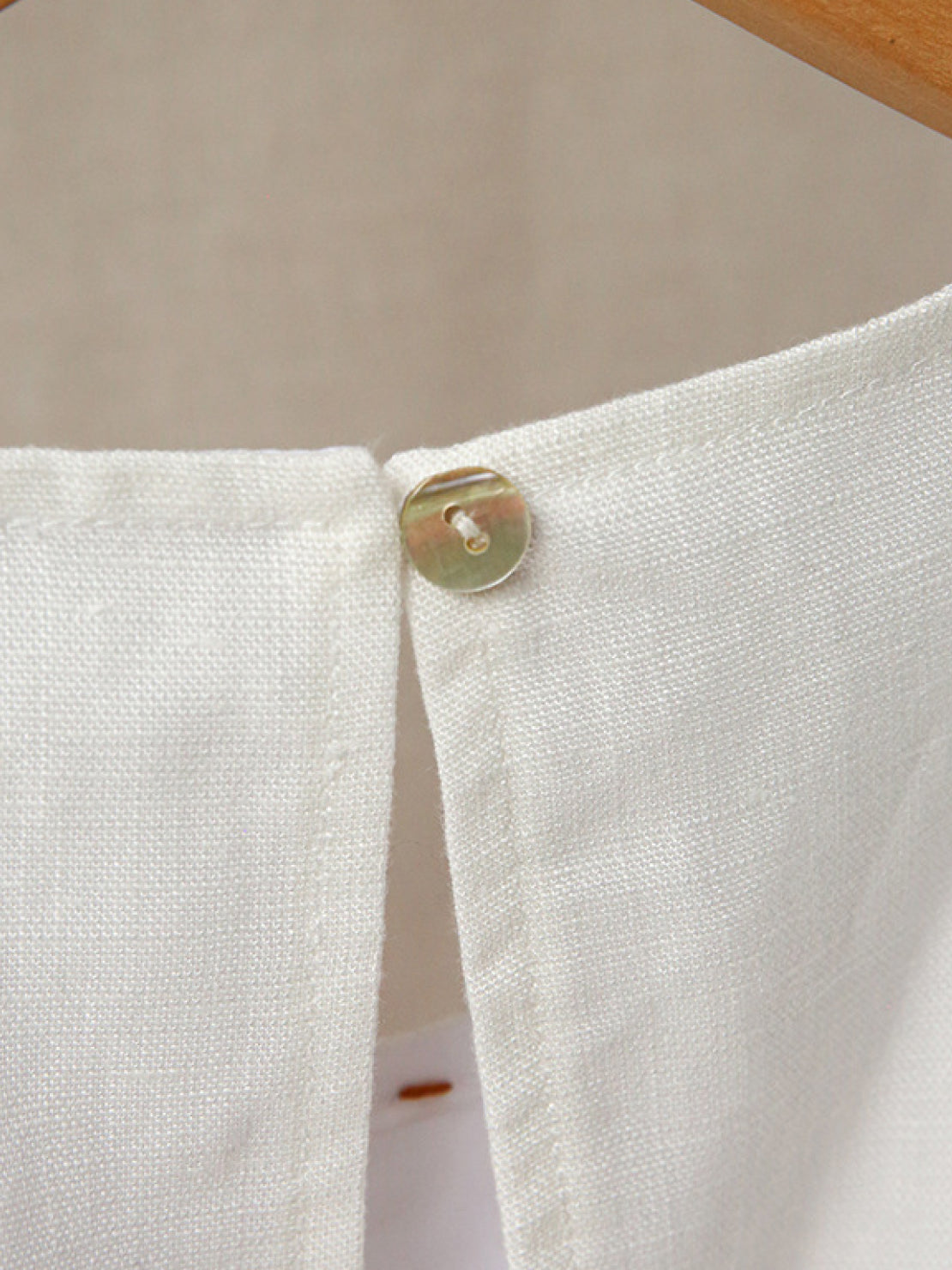 Sleeveless linen lyocell blend dress with relaxed A-line silhouette in white and black colors
