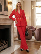 Double-breasted blazer with gold lion-head buttons and wide-leg trousers co-ord set in structured suiting fabric