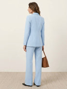 Double-breasted blazer with gold lion-head buttons and wide-leg trousers co-ord set in structured suiting fabric