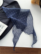 Lightweight 100% linen neck scarf with timeless checkered pattern and natural rolled edges, styled around neck.