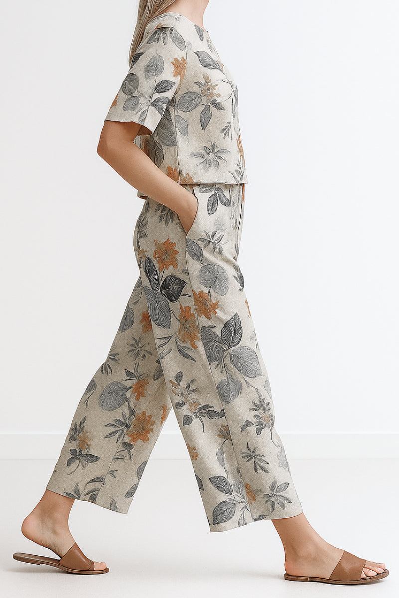 Woman wearing Breezy Meadow Two-Piece Set with relaxed fit top and wide-leg trousers in lightweight fabric