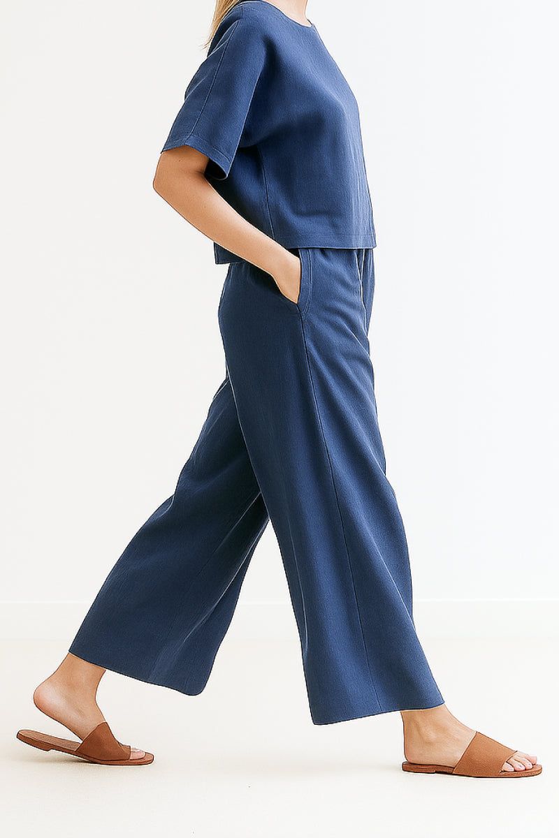 Woman wearing Breezy Meadow Two-Piece Set with relaxed fit top and wide-leg trousers in lightweight polyester fabric