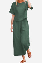 woman wearing Breezy Meadow Two-Piece Set with relaxed fit top and wide-leg trousers in light polyester fabric