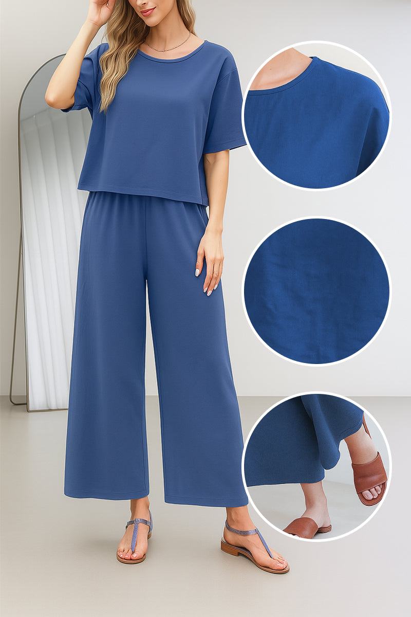 woman wearing Breezy Meadow Two-Piece Set with wide sleeves and wide-leg trousers in relaxing outdoor setting