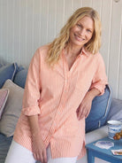 Peach oversized linen shirt with back pleat and button-up design