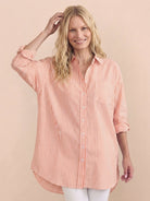 peach oversized linen shirt with back pleat and button-up design