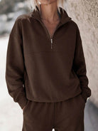cotton-blended two-piece tracksuit with high collar zipper and relaxed fit pants