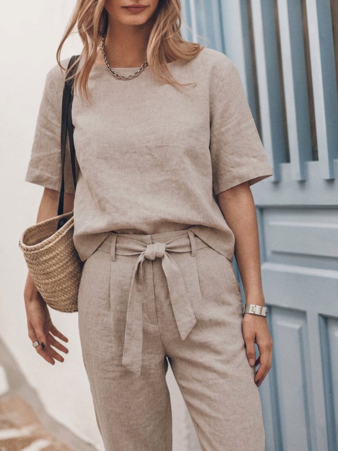 Model wearing breathable cotton linen set monochrome two-piece outfit outdoors