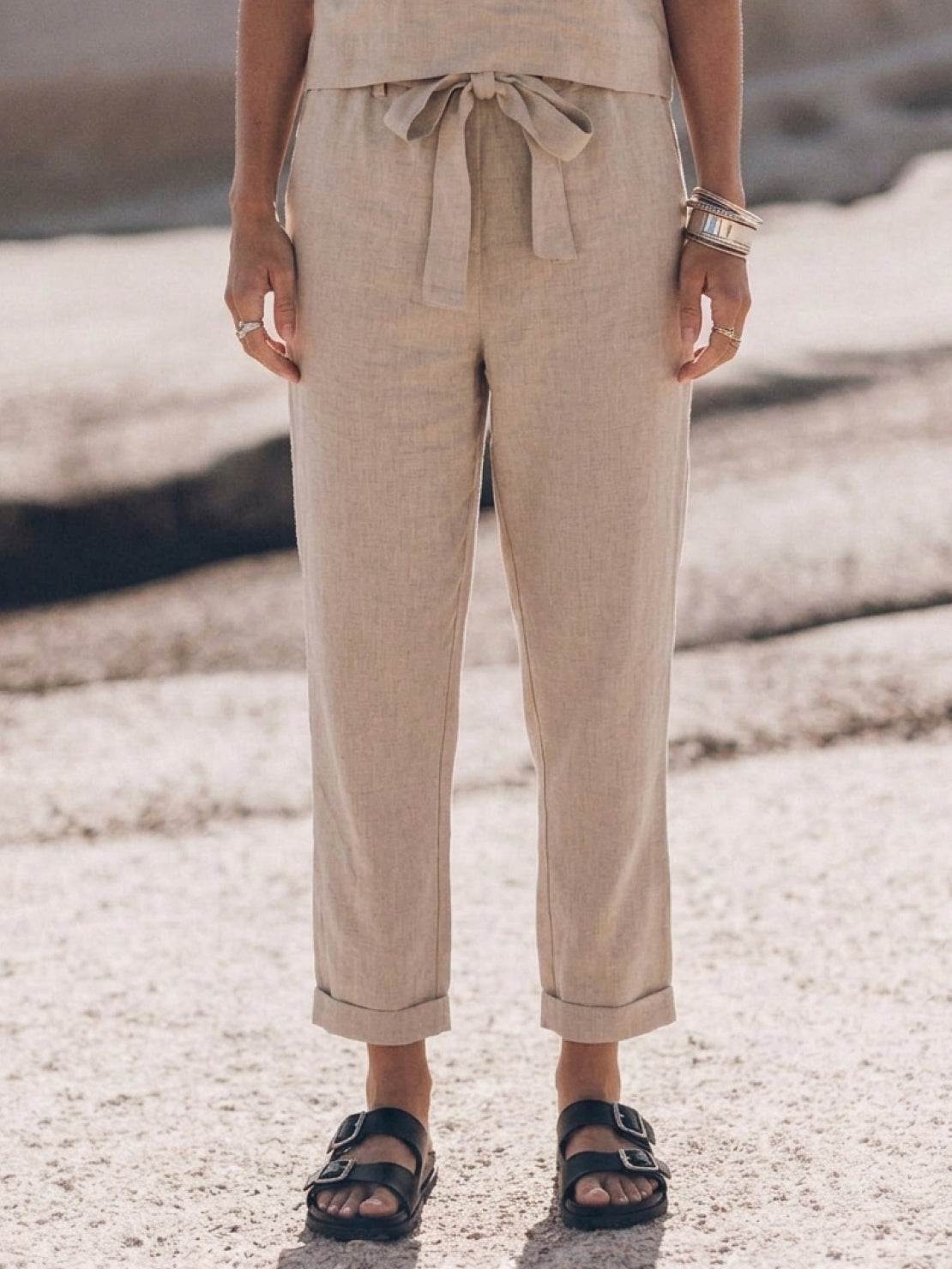 Woman wearing a relaxed cotton linen set with monochrome short-sleeve top and straight-leg pants