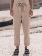 Woman wearing a relaxed cotton linen set with monochrome short-sleeve top and straight-leg pants