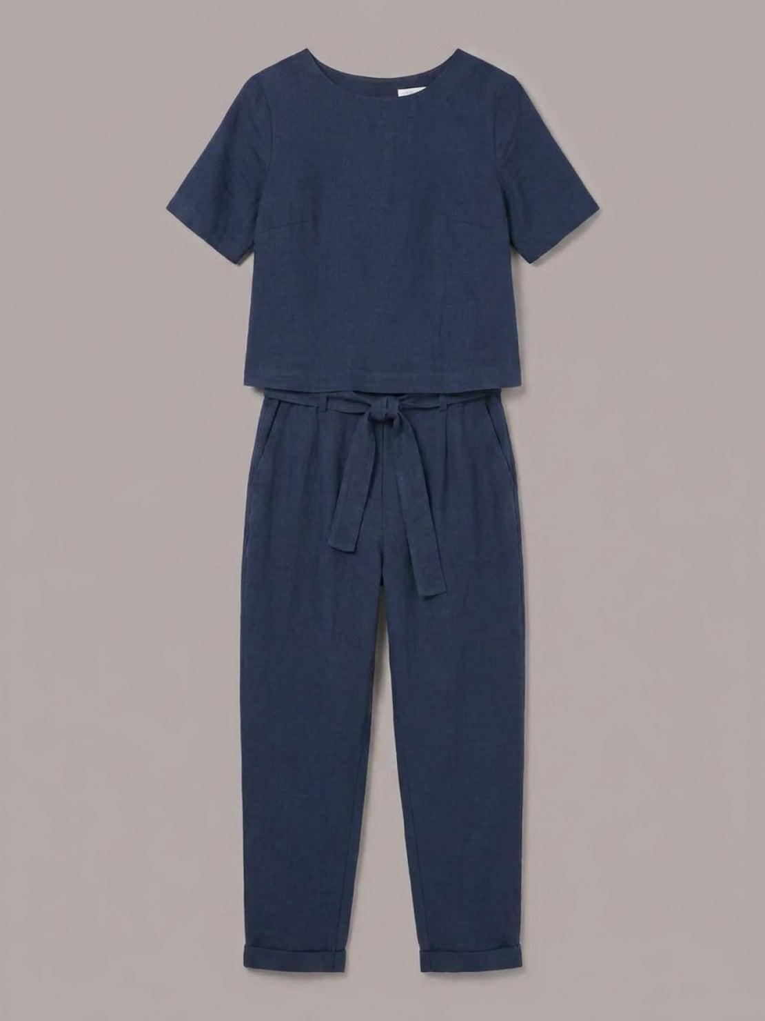 Woman wearing relaxed cotton linen set with short-sleeve top and straight-leg pants in monochrome tones