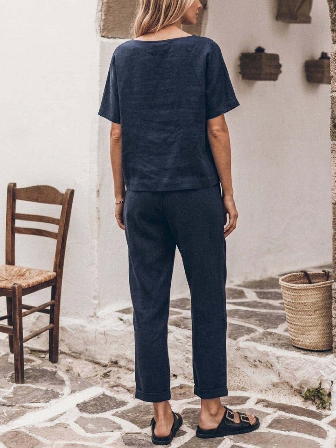 woman wearing relaxed 100% cotton linen set with monochrome short-sleeve top and straight-leg pants
