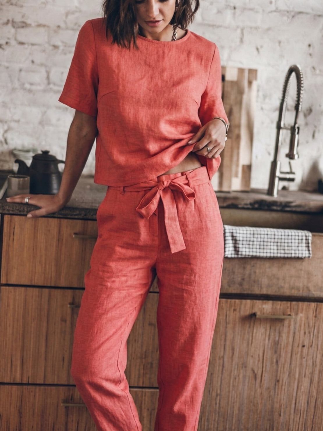 Woman wearing relaxed fit cotton linen set with monochrome short-sleeve top and straight-leg pants