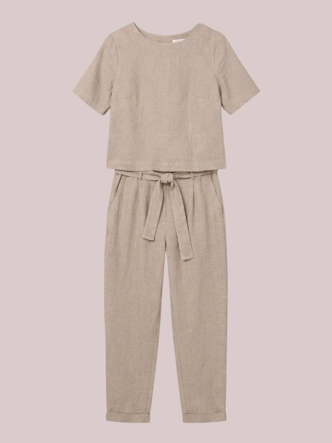 Woman wearing relaxed fit cotton linen set with short-sleeve top and straight-leg pants in monochrome tones