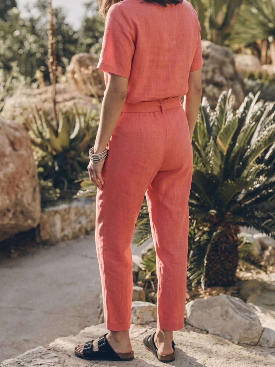 woman wearing relaxed cotton linen set with short sleeves and straight-leg pants in monochrome color