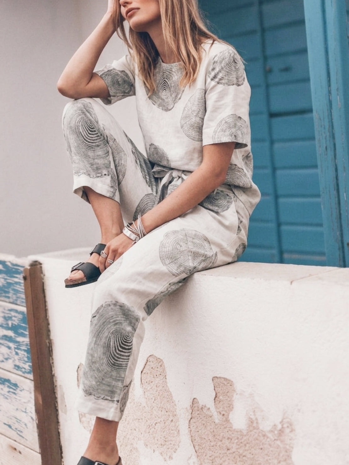 woman wearing relaxed cotton linen set in monochrome neutral tones