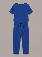 woman wearing relaxed cotton linen set with monochrome top and pants