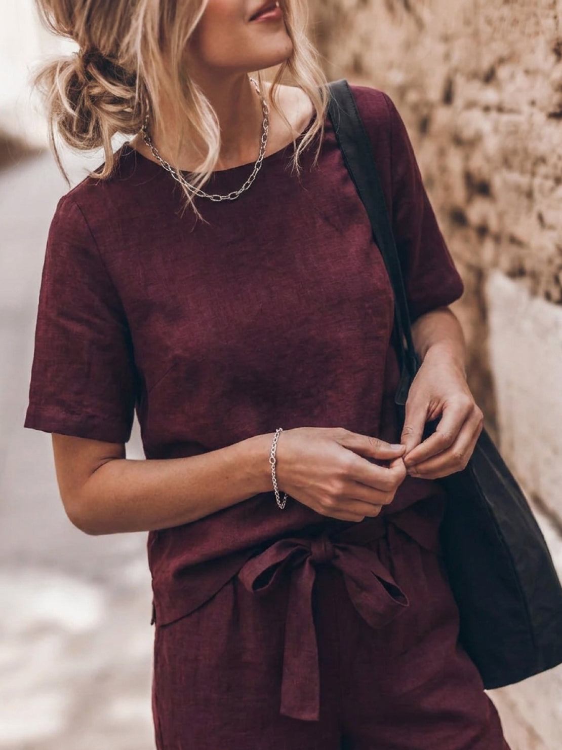 woman wearing relaxed cotton linen set with short-sleeve top and straight-leg pants in monochrome