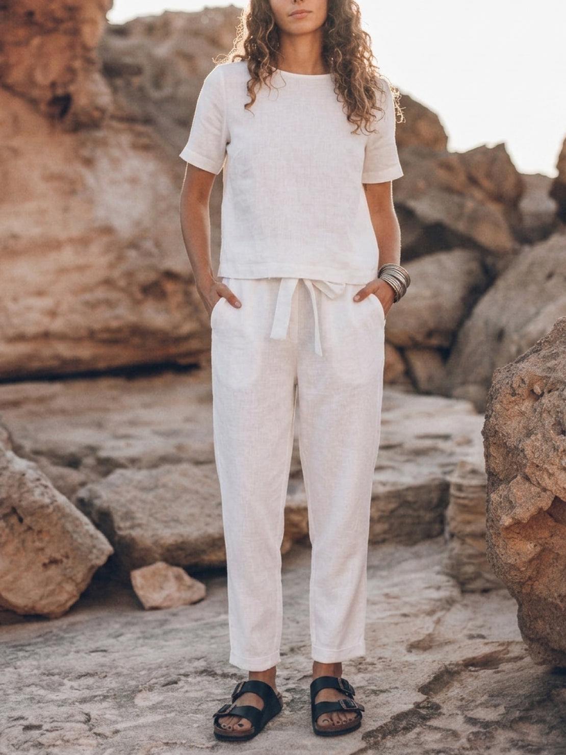 woman wearing relaxed fit 100% cotton linen set in monochrome tones with short sleeves and straight-leg pants