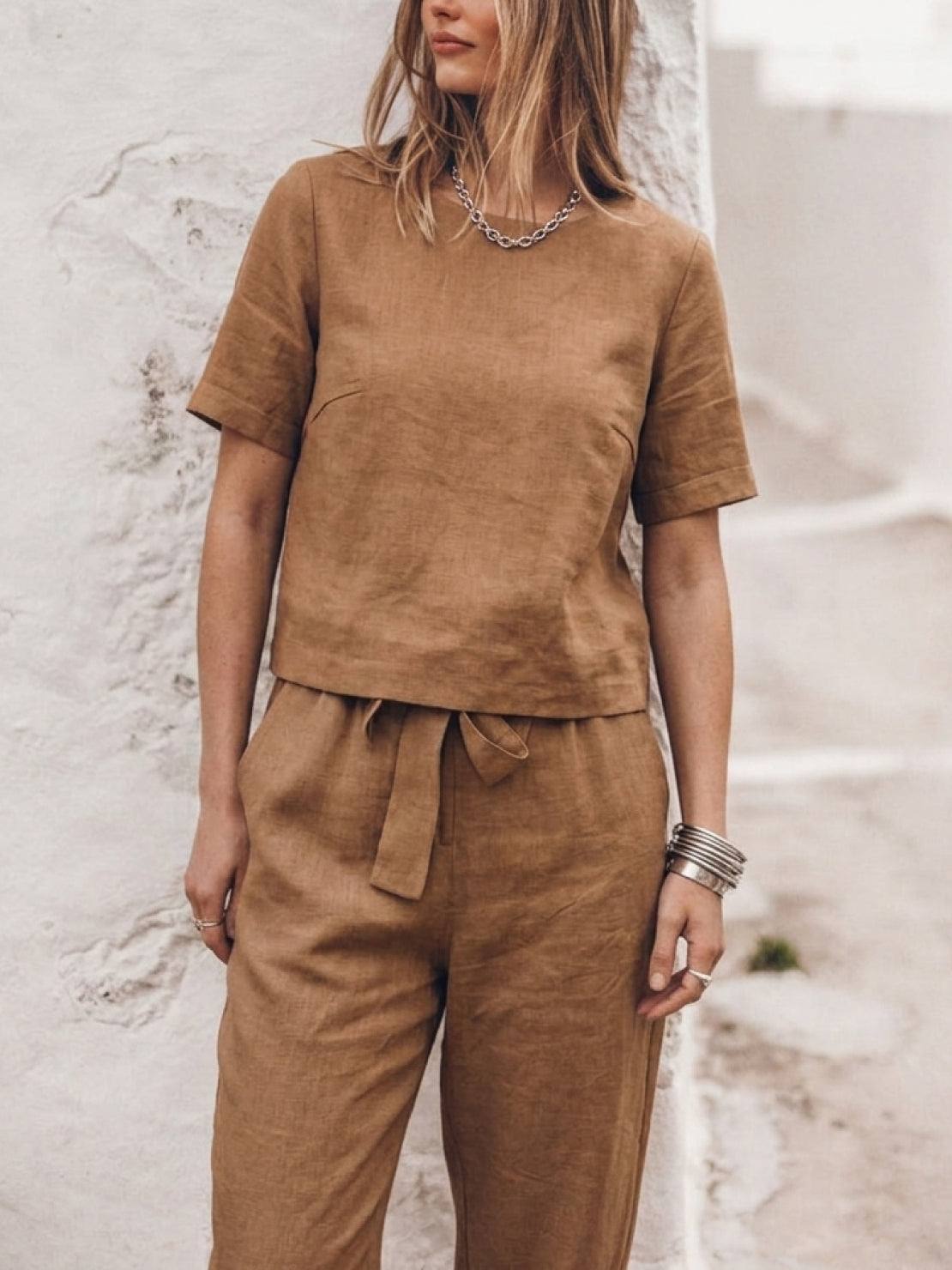 woman wearing relaxed cotton linen set with short-sleeve top and straight-leg pants in monochrome tones