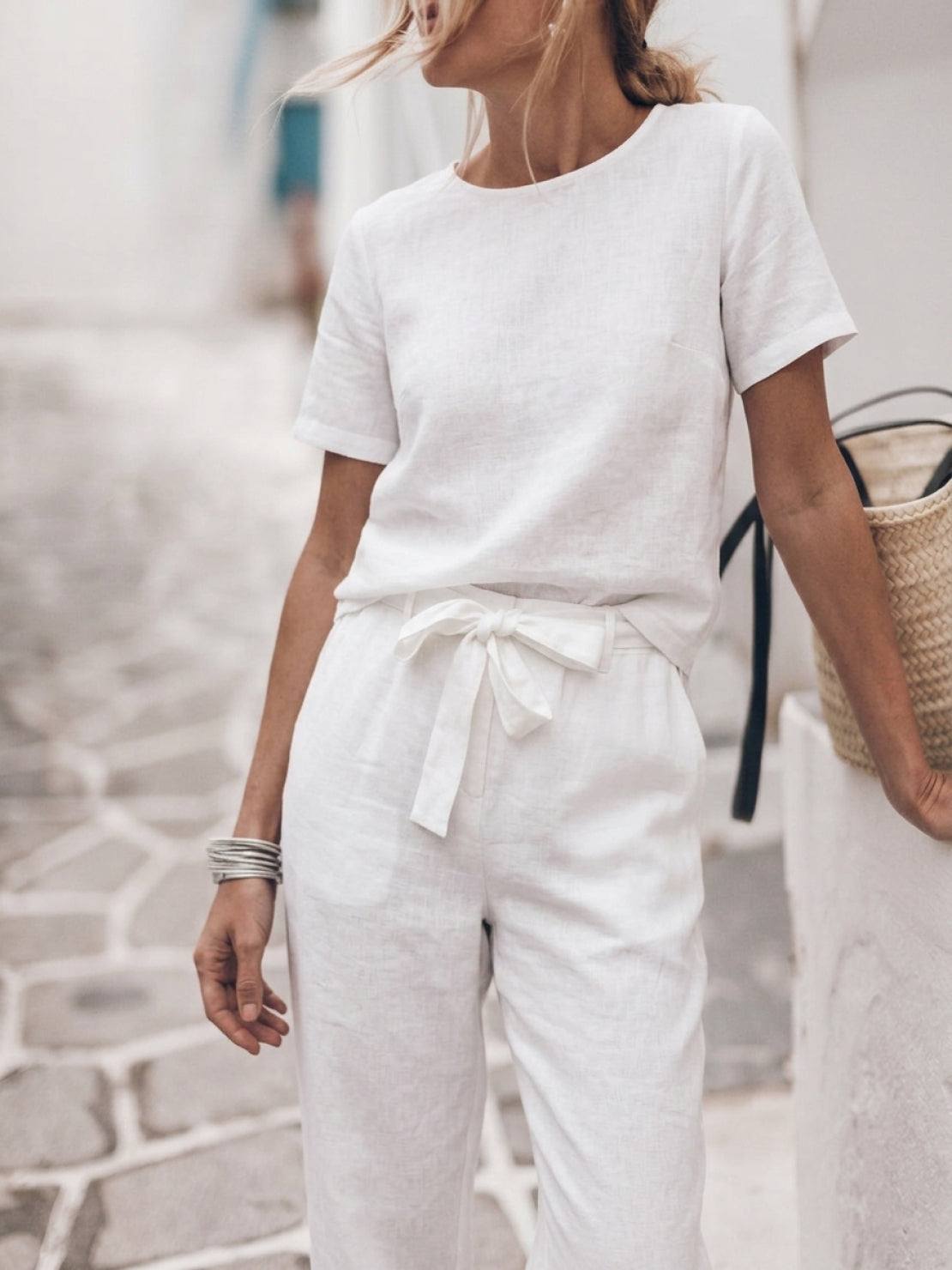 woman wearing relaxed cotton linen set with short-sleeve top and straight-leg pants in monochrome tones