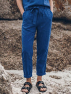 Model wearing relaxed cotton linen set with short-sleeve top and straight-leg pants in monochrome tones