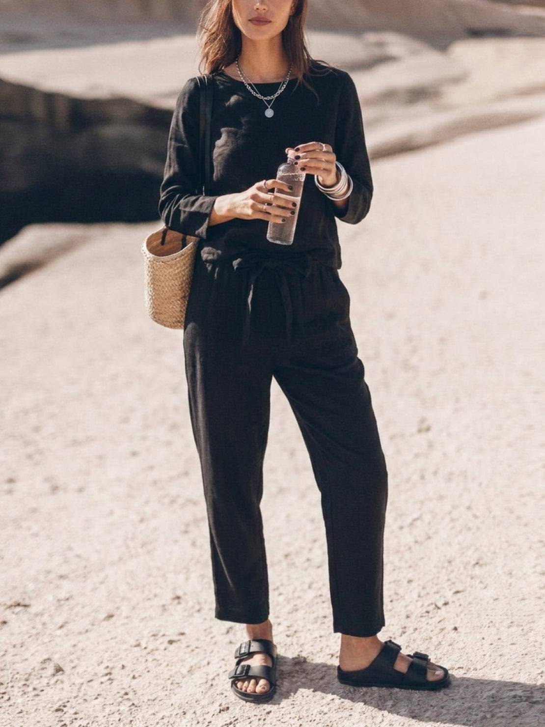 Woman wearing cotton-linen monochrome relaxed longline top and wide-leg pants set