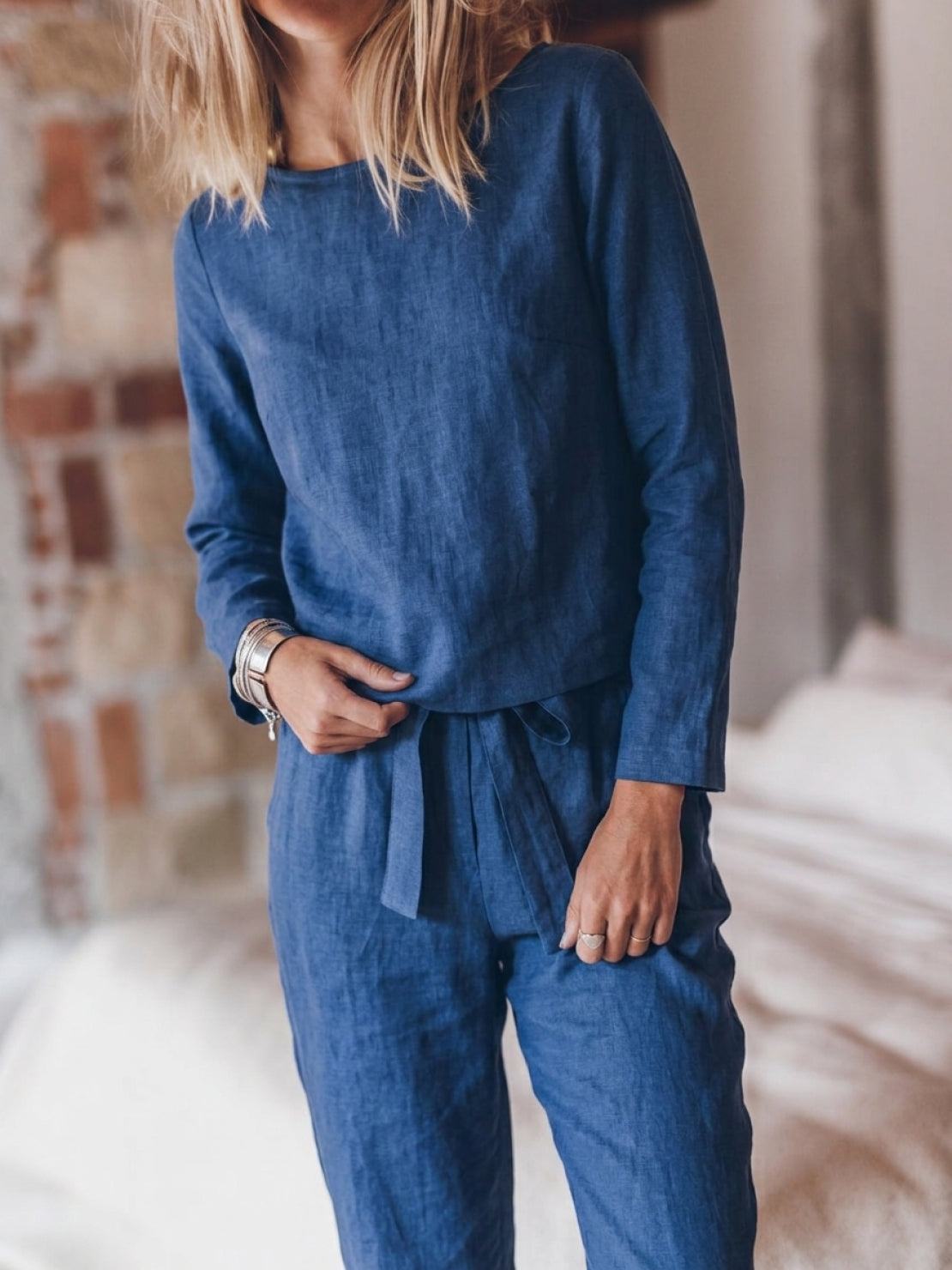 Woman wearing relaxed cotton-linen monochrome capsule outfit with longline top and wide-leg pants